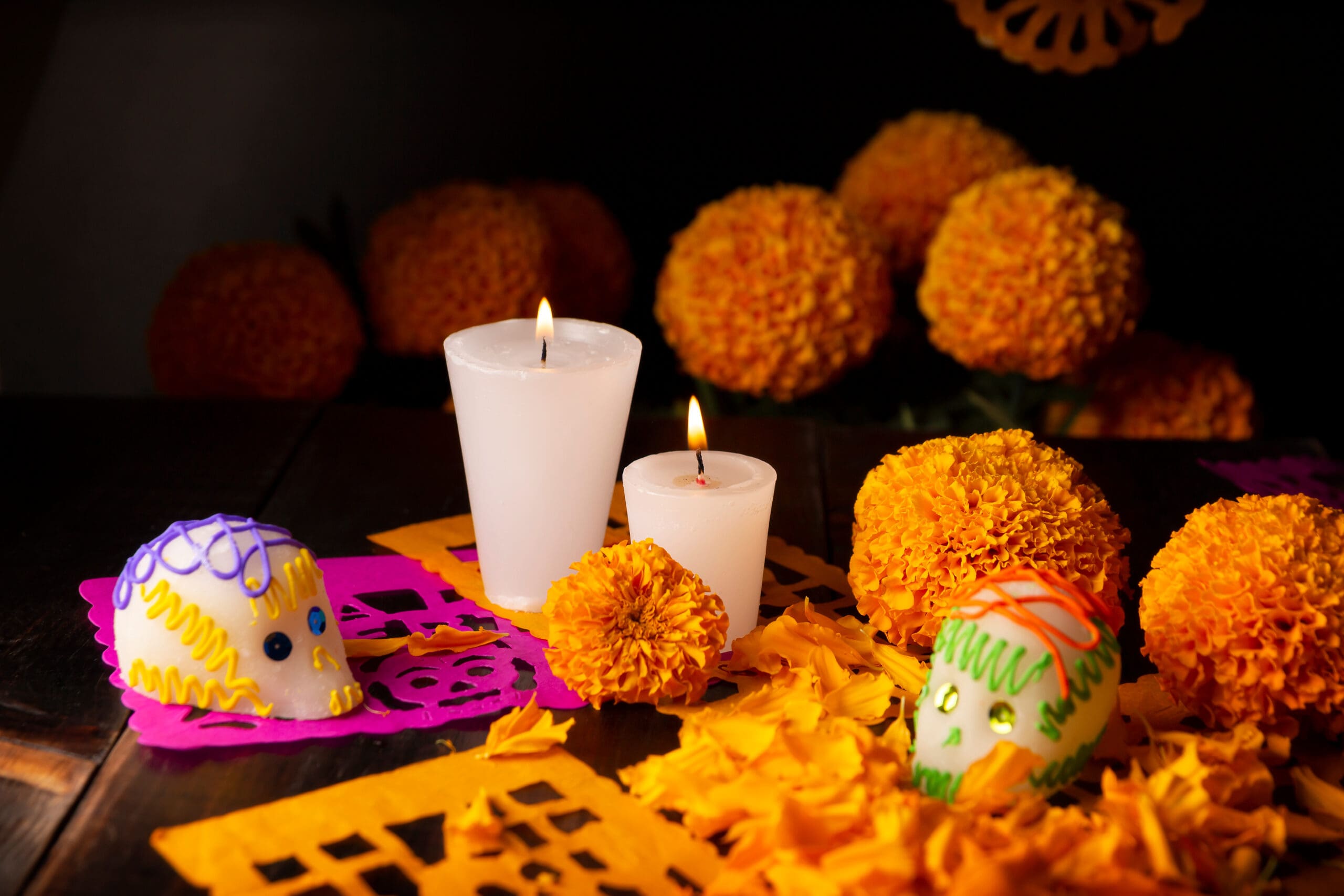 Sugar skull with Candles, Cempasuchil flowers or Marigold and Papel Picado. Decoration traditionally used in offering altars for the celebration of the day of the dead in Mexico. sugar skull with candles, cempasuchil flowers or marigold and papel picado. decoration traditionally used in offering altars for the celebration of the day of the dead in mexico.